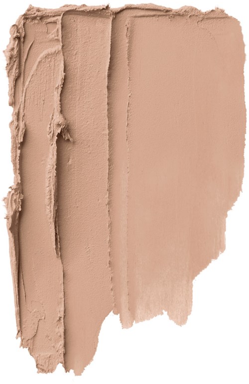 En beige sminkkräm utbredd med delar släta och en texturerad, ojämn sida.