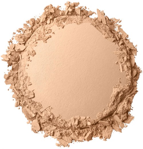A round area of beige powder surrounded by broken, crumbled powder edges on a white background.