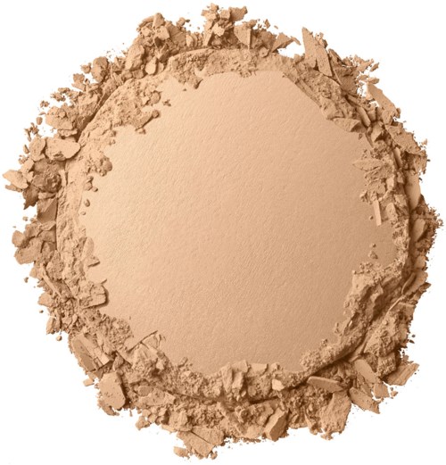 En rund hög av beige pulver med spridda bitar runt kanterna.