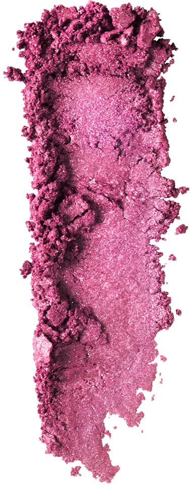 Rosa finmalt pulver spridd ojämnt i en vertikal linje med lite pulver runt omkring.