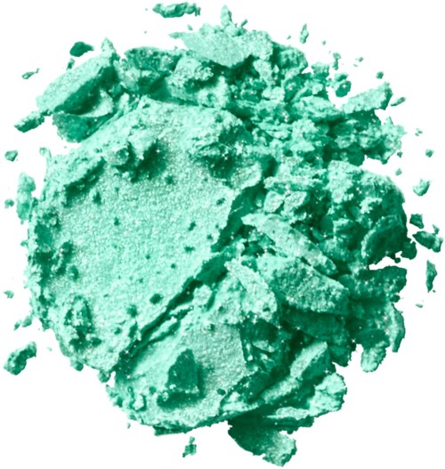 A crushed, greenish powder or clay with a rough texture and irregular pieces scattered around.