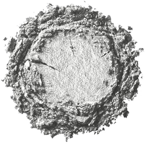A central round area with rough, textured edges, resembling a weathered, scratched surface.