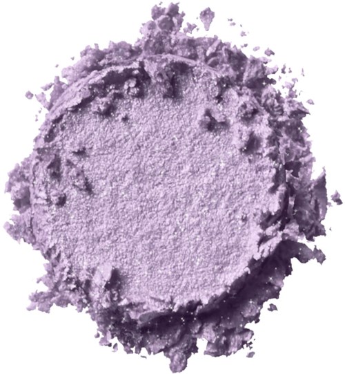 A purple powder or pigment forms a rough, uneven circular shape with loose particles around the edges.