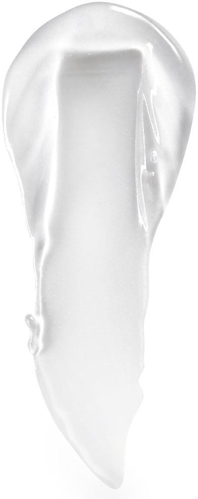 En vit kräm eller lotion med en slät, krämig textur på svart bakgrund.