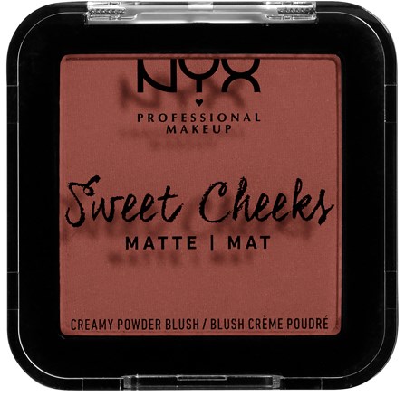 En makeuprouge-aska med rosa nyans, svart och rosa text, och ett genomskinligt lock. Märket är NYX.