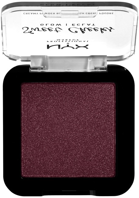 A makeup eyeshadow in a black compact with a clear lid, dark red shimmer color, and text on the lid.