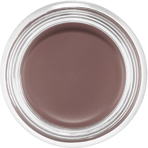En rund beholder med beige-brun krems eller sminke inni, sett ovenfra.