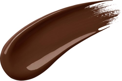 En tykk stripe av brun flytende makeup eller krem med en glansfull yta og innsvingede kanter.