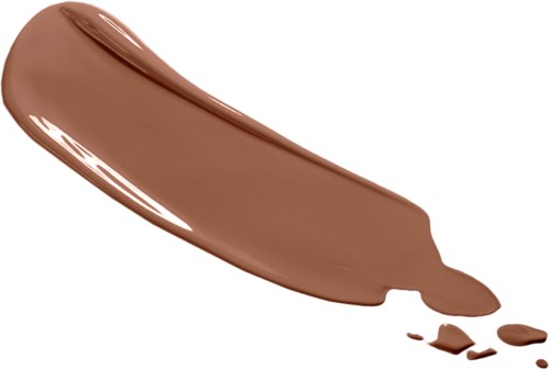 Ruskea meikkivoide tai lotion ulottuu valkoiselle taustalle, hieman rikkoontuneina.