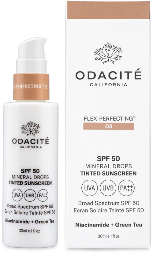 En hvit flaske solkrem med pumpe, merket Odacité, med eske som viser lignende design og produktdetaljer.