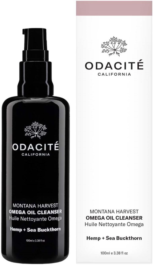 A black bottle with a pump, labeled Odacité Montana Harvest omega oil cleanser, next to a white box with similar design.