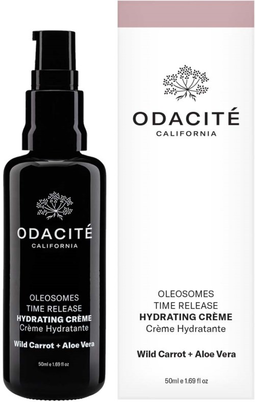 A black bottle of Odacité hydrating cream with a pump, and a white box featuring the same branding and product details.