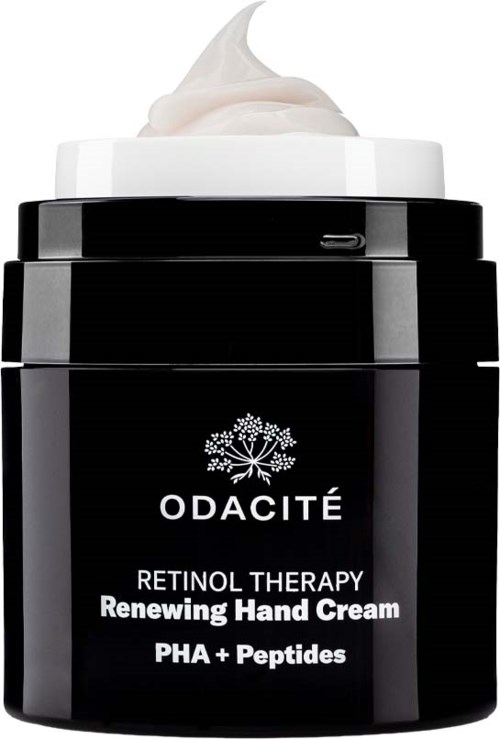 En svart burk handkräm med vit kräm på toppen, märkt Odacité, som främjar retinolterapi med PHA och peptider.