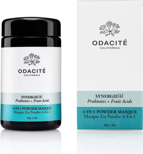 A black jar and white box for Odacité probiotic powder mask, with blue label and text about ingredients and product type.