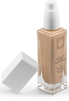 En foundationflaska med vit kork och en genomskinlig rektangulär bas. Etiketten säger "Absolute Cover Foundation."