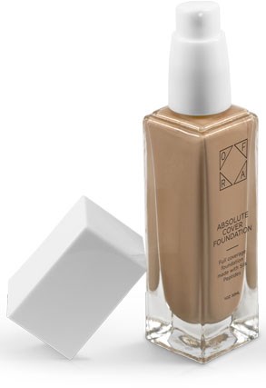 En flaska med beige flytande foundation och en vit lock, med en vit kvadratisk lock bredvid.
