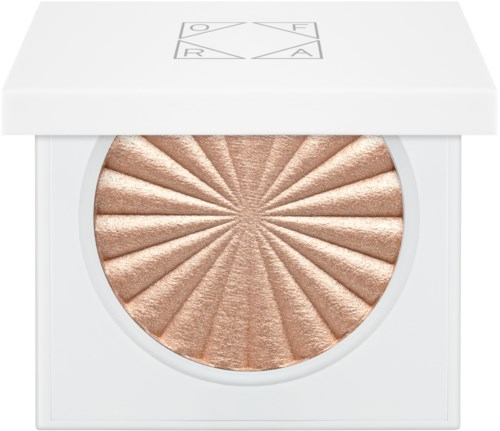En glansig, bronzig highlighter i en rund panna i en vit kompaktförpackning med en geometrisk logga på toppen.