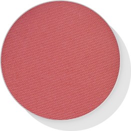 En rund rød makeup blush med en blød, tekstureret overflade.
