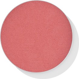 Round pink makeup blush or powder with a textured surface and a white base.