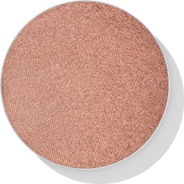 Ett runt makeup-puder med en mjuk, varm persikafärg och matt yta.