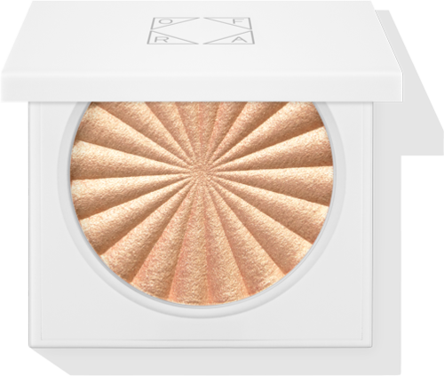 Eine runde Make-up-Box mit schimmerndem Goldpuder im Inneren, mit einem weißen Deckel oben. Der Deckel hat Texte und Symbole.