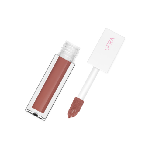 En læbepommetub med hvid applikator og lyserødt-brunt gloss. Mærket OFRA er på det hvide låg.