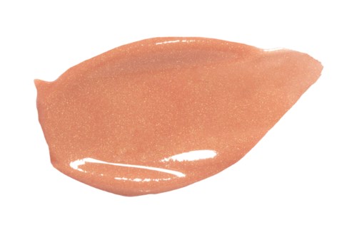 Een swatch van licht perzikkleurige concealer of foundation met een glanzende afwerking.