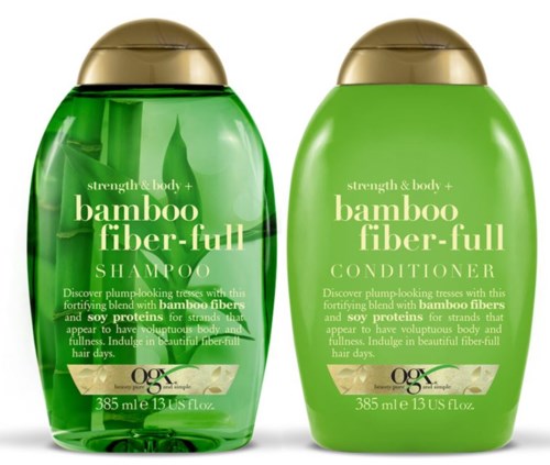 Två gröna flaskor med bambufiber-schampo och balsam med guldkorkar, märkta för hårvård.