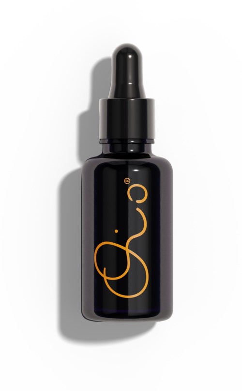 Een zwarte druppelfles met gouden logo en druppelkapsel, waarschijnlijk voor huidverzorging of cosmetica.