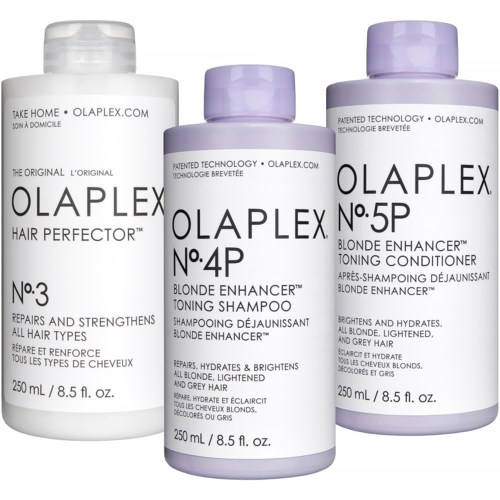Tre flasker med hårpleieprodukter merket Olaplex, for blonde, med ulike numre og funksjoner, ordnet side om side.