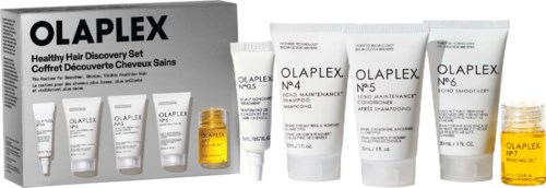 A set of hair care products labeled Olaplex, including shampoos, treatment bottles, and a yellow oil container.