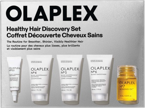 Olaplex hair care set with four tube products and one small jar, for shiny, healthy hair.