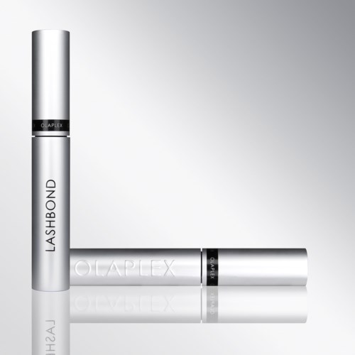 Two silver tubes, one standing and one lying down, labeled LashBond and OLAPLEX, likely hair care products.