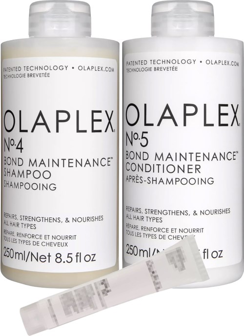 To hvide flasker med Olaplex hårplejeprodukter, en shampoo og en balsam, med en lille teststrim foran.