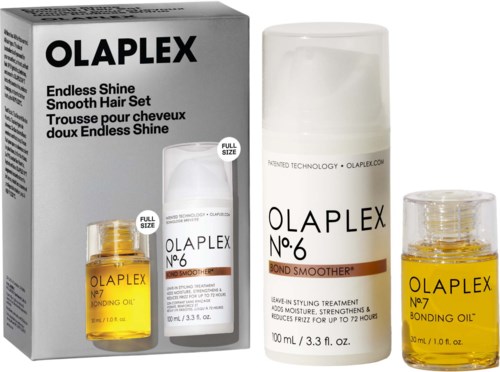 Das Bild zeigt Olaplex-Haarpflegeprodukte, darunter eine Box und Flaschen für Haarbehandlung und Öl.
