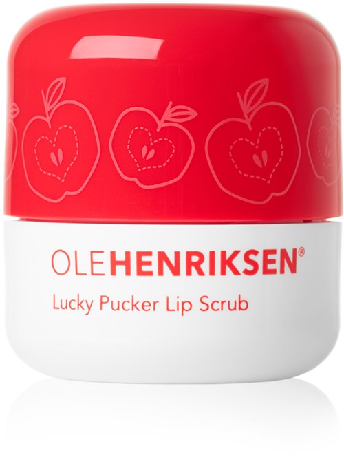 Röd och vit behållare med äppleillustrationer och text för Ole Henriksen läppskrubb.