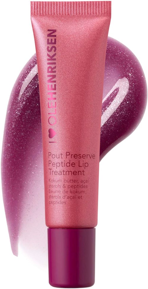 Een roze tube lipverzorging met een paarse dop, met een dot roze en paarse crème erachter.