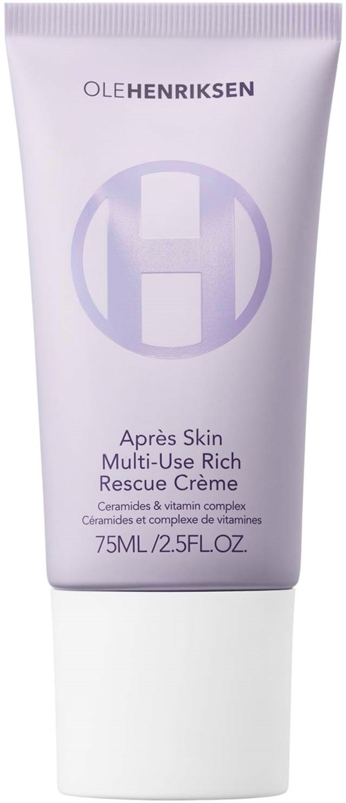 En hvit tube med lilla og grå tekst, merket 'Oleh Henriksen' og 'Après Skin,' inneholder en hudpleiekrem.