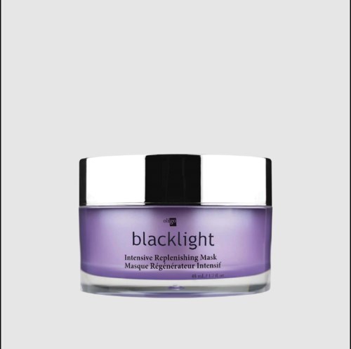 A jar of purple face mask labeled 'blacklight' for intensive skin renewal.