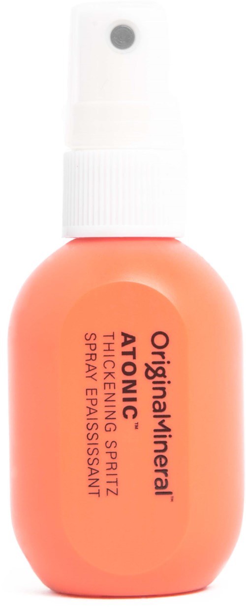 Liten orange sprayflaska med vit topp, märkt för ansiktsspray, tonad, med svart text.