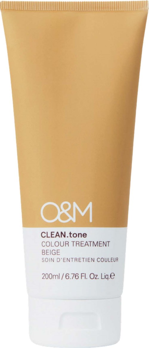 En beige tube med hudfarvetreatmentprodukt, hvid etikett, gylden hætte, indeholder 200 ml kosmetisk creme.
