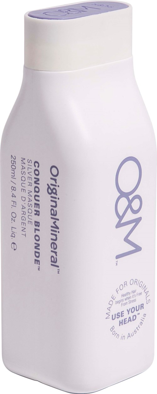 En hvid shampoo-flaske med lilla tekst og afrundet låg, mærket 'O&M Original Miner.'