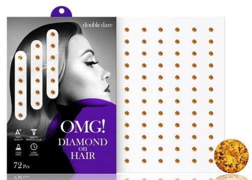 Förpackning med små diamantliknande dekorationer och ett kvinnligt ansikte i profil. Texten nämner diamanthårdekorationer.