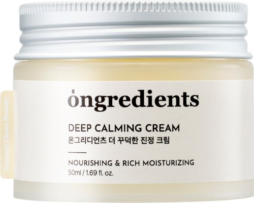 Słoik z Deep Calming Cream zawierający składniki, odżywczy i nawilżający, w białym pojemniku z nakrętką.