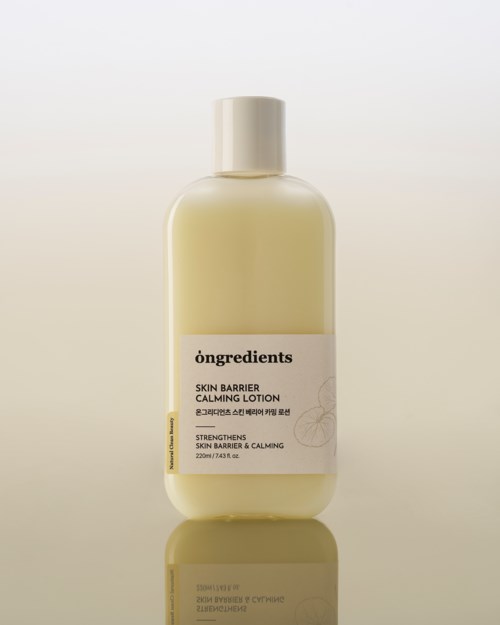 A beige bottle of soothing lotion named 'Skin Barrier Calming Lotion' with a white cap and simple label.