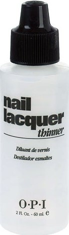 Liten vit flaska med svart lock, märkt 'nail lacquer thinner', används för att rengöra nagellacksverktyg.