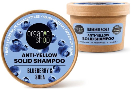 En rund schampolapp och en burk visar ingredienser som blåbär och shea för anti-gulning fast schampo.