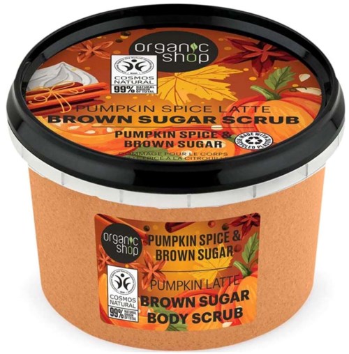 En burk med ekologisk pumpakrydda och brunt socker kropps scrub med höstlöv på etiketten.