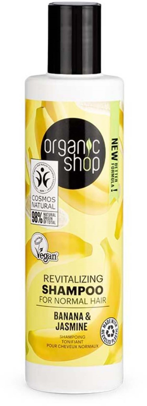 En flaske med revitaliserende sjampo med banan og jasmin, for normalt hår, fra Organic Shop.