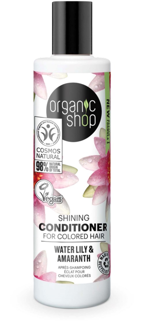Valkoinen pullo mustalla korkilla, merkinnällä Organic Shop hoitoaine värjätylle hiuksille, pinkki ja viheriä kukkakuvitus.